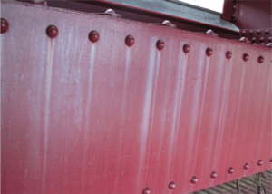 Investigating Failure: Considerations for Reconstruction of a Bridge Exhibiting Staining